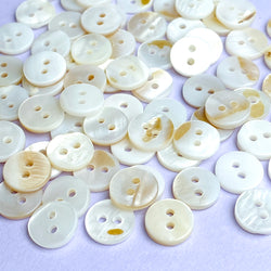 Re-Stocked, White with Butterscotch Highlights 3/8" River Shell 2-Hole 9mm Button, Pack of 75/80   # LP-68