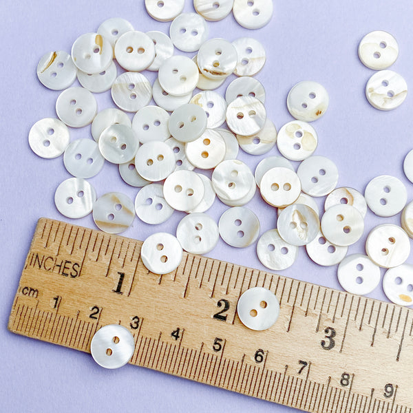 Bulk Special, White, Some with Butterscotch Backs 3/8" River Shell 2-Hole 9mm Button, Pack of 500   # LP-68/500